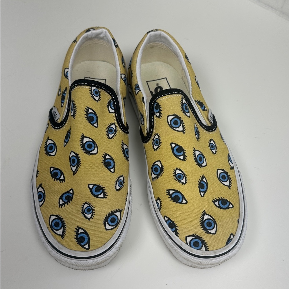 Vans Slip-On Sneakers in Yellow with Blue Eye Print